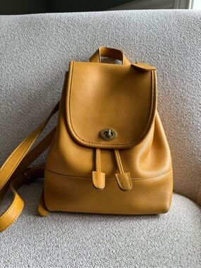 Coach Mustard Leather Drawstring Backpack